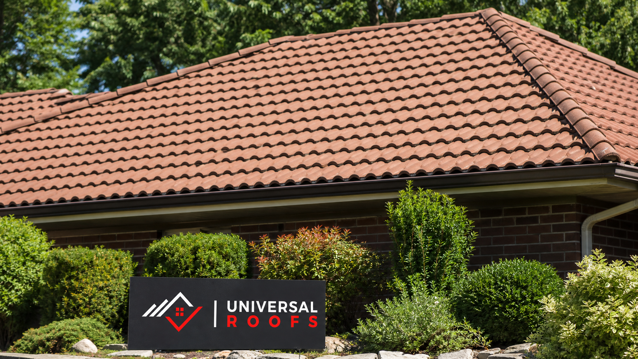 Freshly repaired clay tile roof on a Toronto home under bright summer sun with no visible damage
