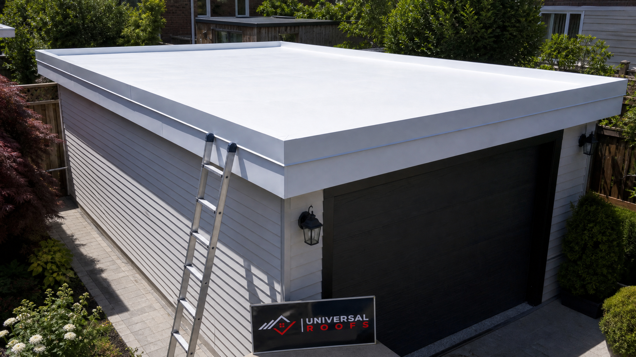 Freshly coated flat garage roof in a Toronto backyard on a sunny summer afternoon, showing a smooth reflective white roof coating finish