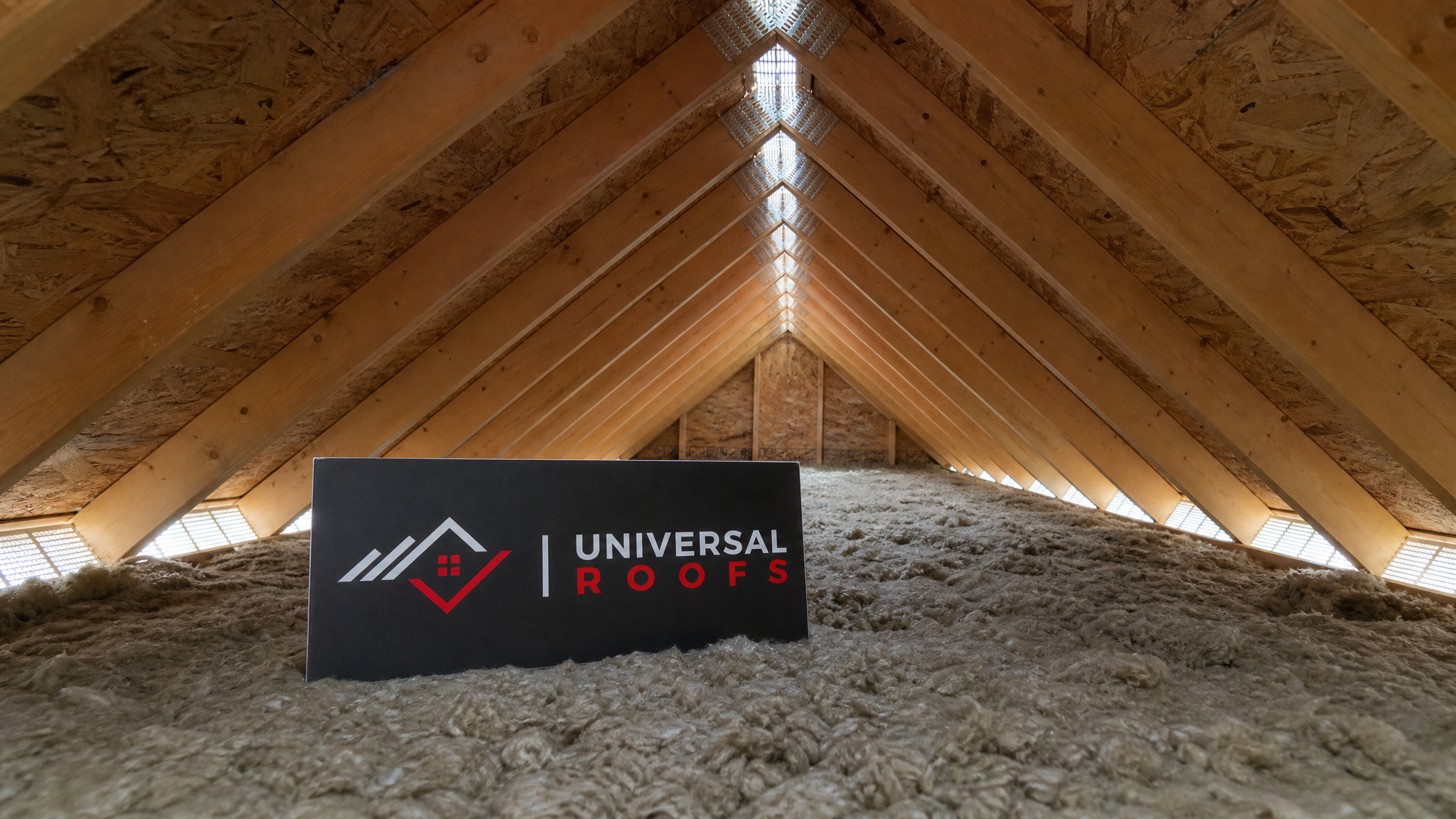 Well-ventilated attic space with balanced soffit and ridge airflow shown in a finished Toronto-area home in summer daylight