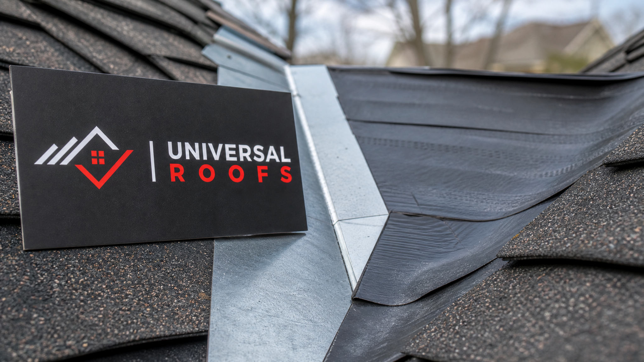 Close-up of overlapping ice and water shield waterproofing membrane and metal flashing detail on a roof valley
