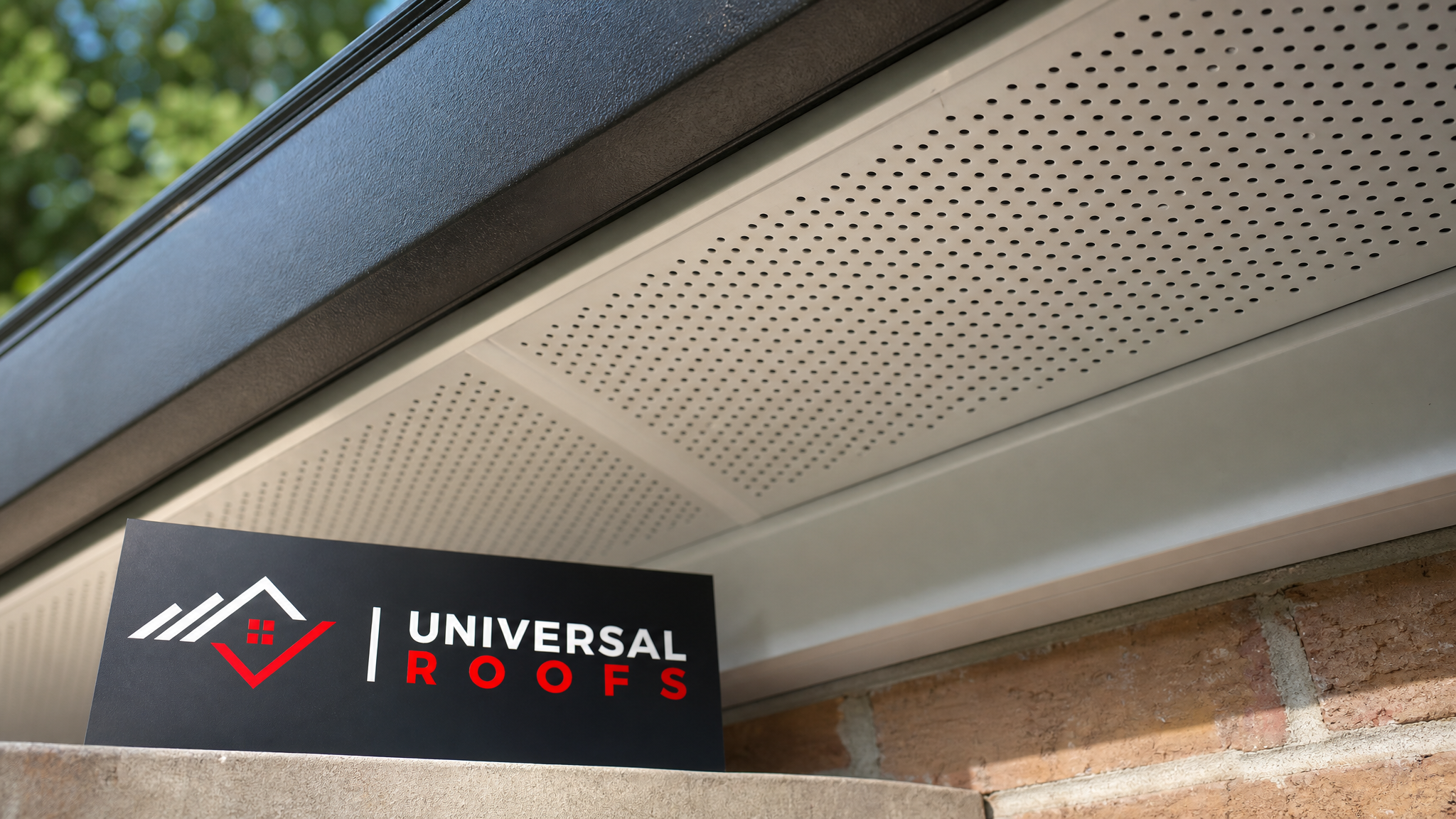 Close-up of vented aluminum soffit panel installed under a roof overhang