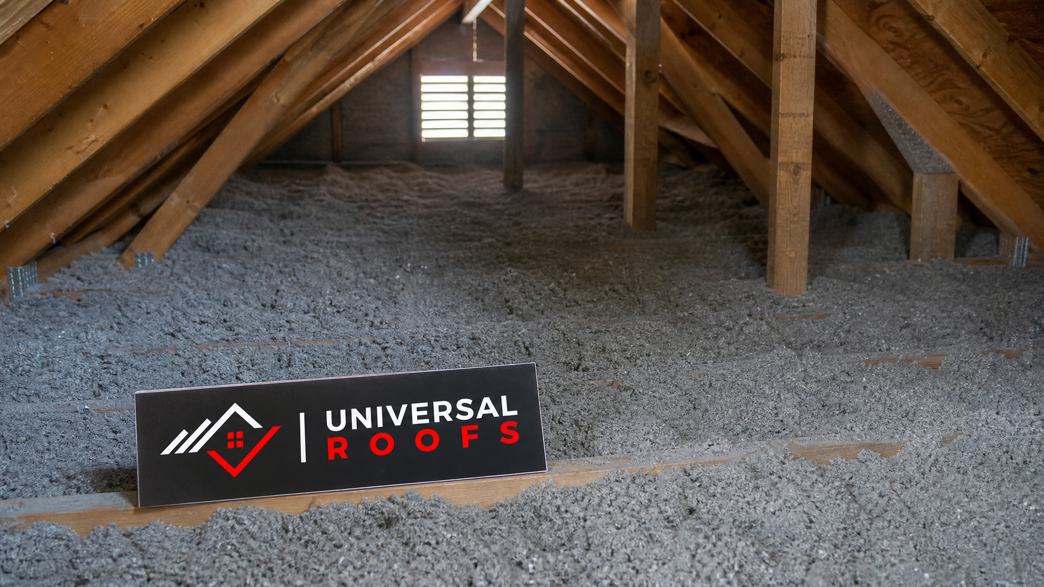 Freshly insulated attic in a Toronto home showing even, deep blown-in insulation across the attic floor in summer daylight