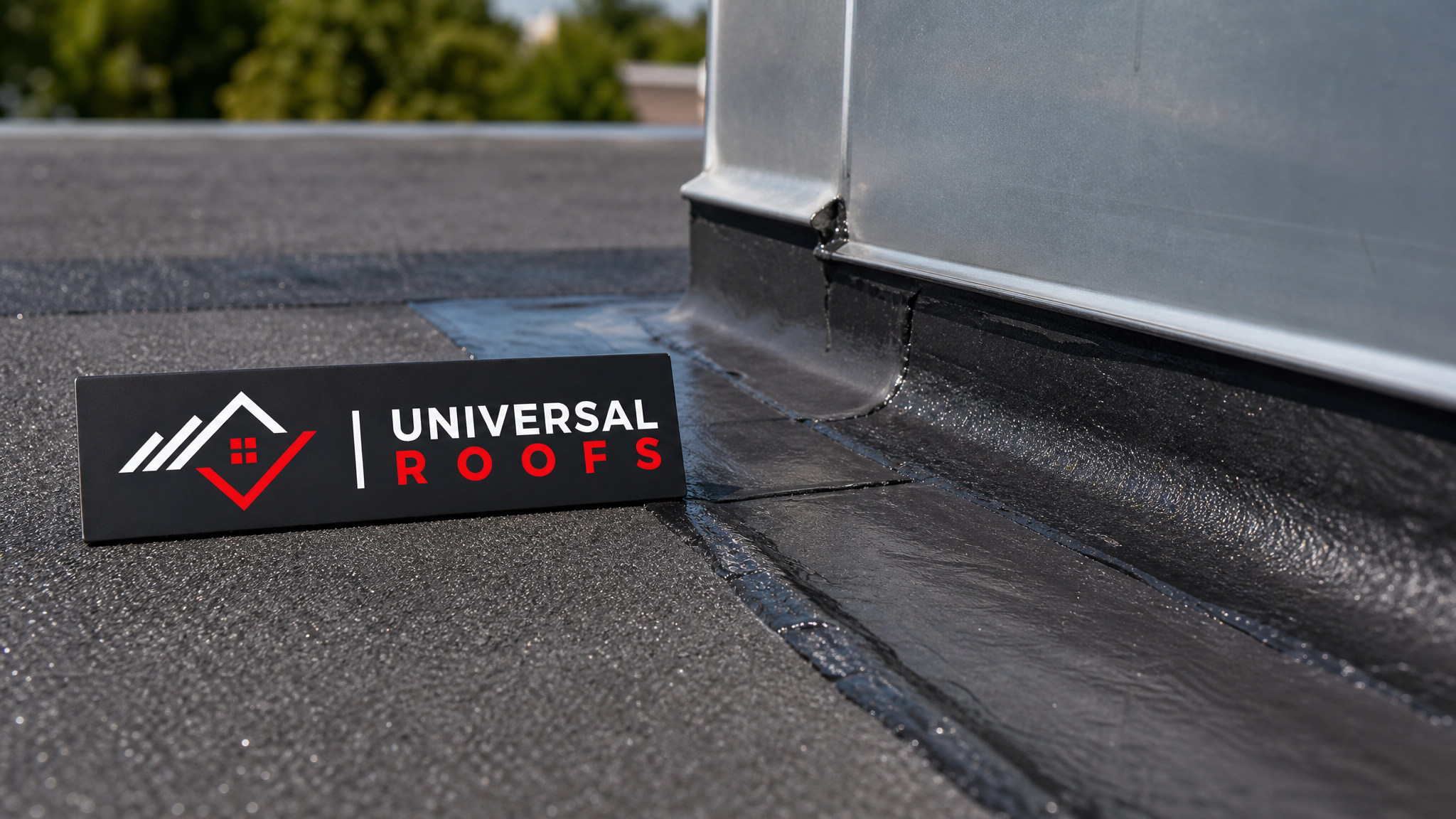 Close-up detail of waterproof membrane seam and flashing installation on a flat roof with a Universal Roofs branded sign placard